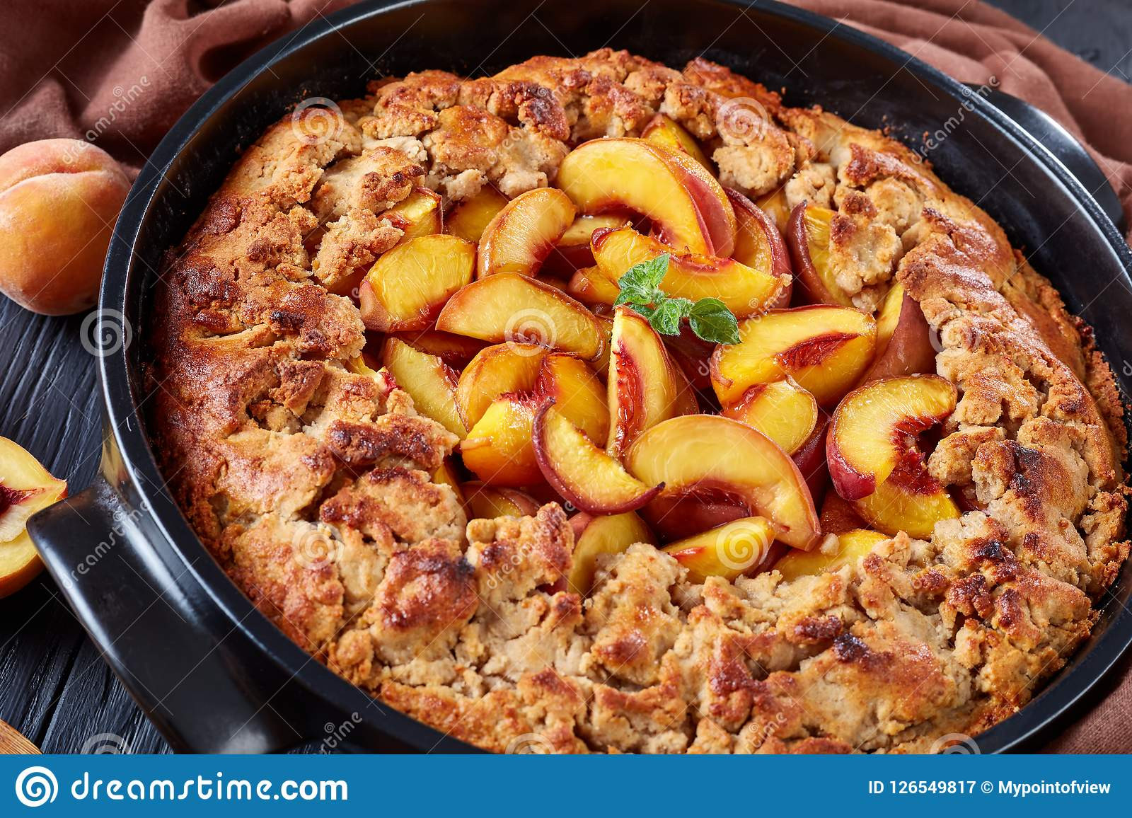 Black Southern Peach Cobbler
 Oven Baked Southern Peach Cobbler In A Black Dish Stock