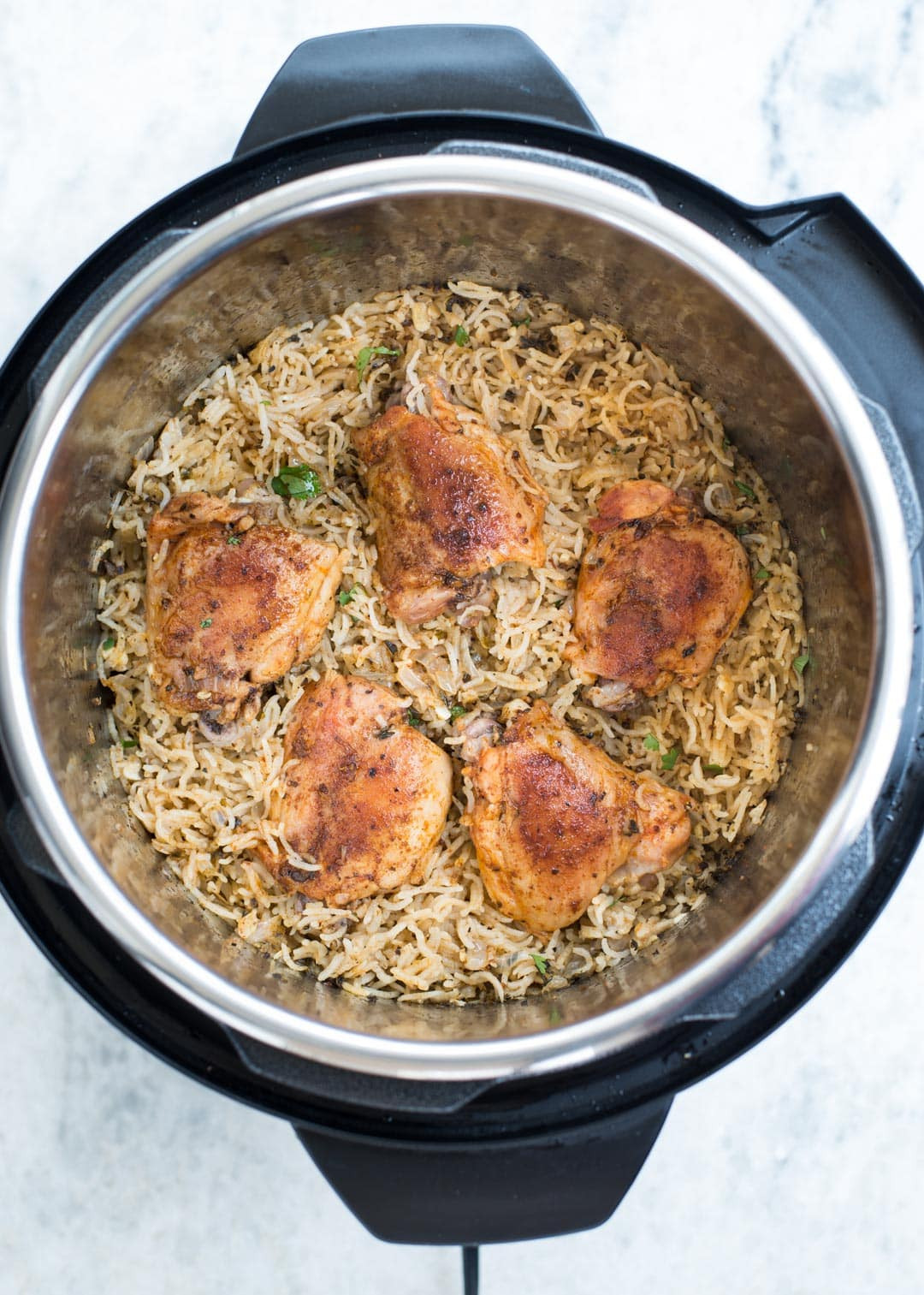 One Pot Chicken Thighs And Rice
 INSTANT POT GARLIC HERB CHICKEN AND RICE