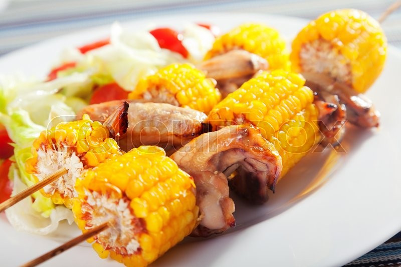 Side Dishes For Chicken Wings
 Chicken wings with corn skewers Salad with cherry