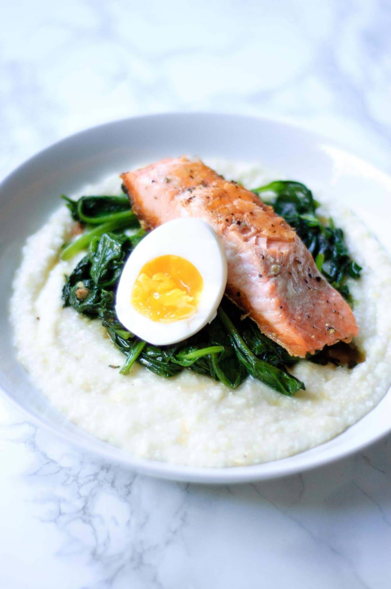Salmon For Breakfast With Eggs
 Salmon and Grits with Garlicky Greens & Boiled Eggs