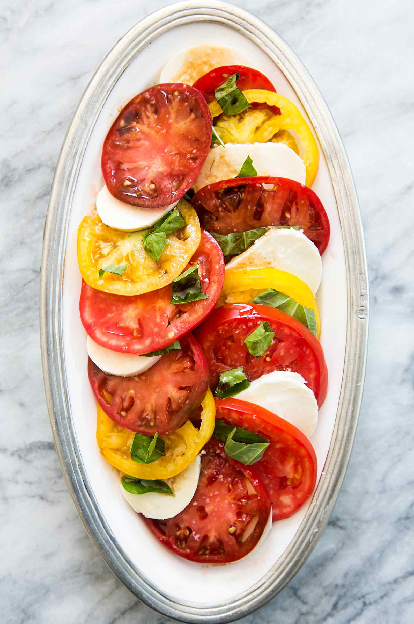 Tomato Caprese Salad
 Heirloom Tomato Basil Mozzarella Caprese Salad Recipe